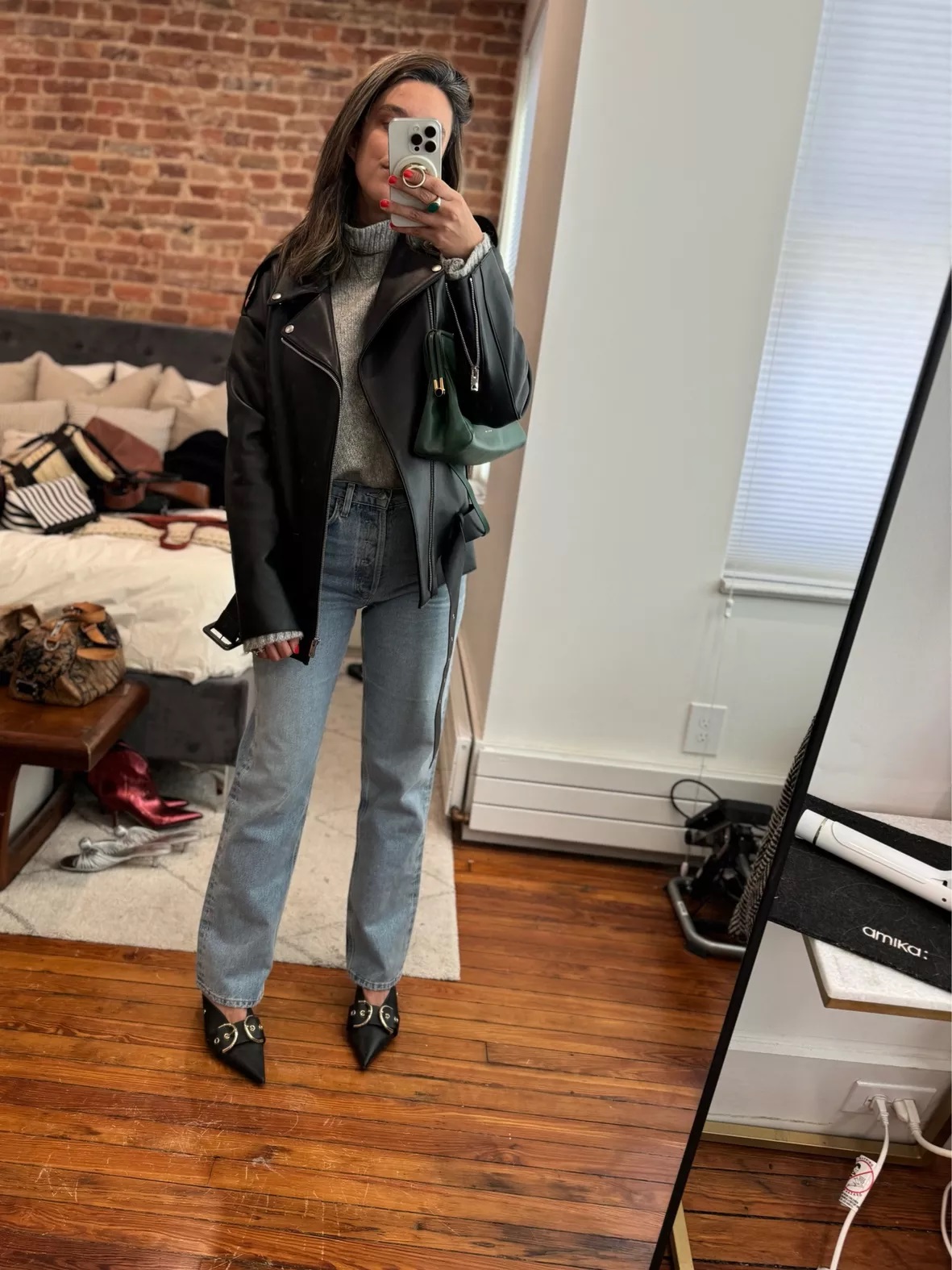 Leather jacket over a cozy sweater-and-jeans combination